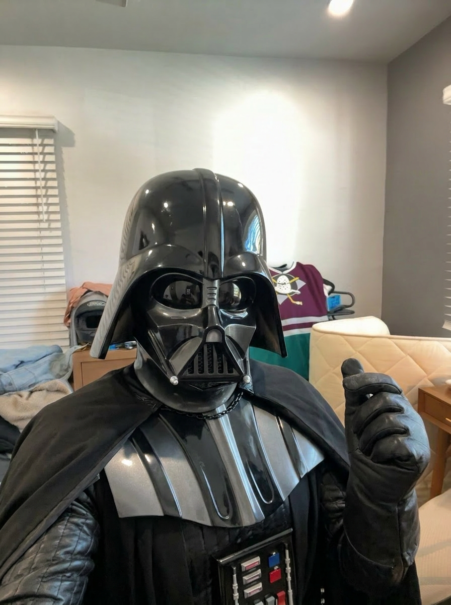 POSE REFERENCE ONLY: use the input image strictly as a reference for body pose, limb positions, head tilt, framing, and camera angle. Do NOT preserve the original subject's identity, face, hair, body type, skin, or clothing. The subject IS a fearsome Sith Lord in a glossy black helmet with breathing-apparatus vents, all-black armored suit, long flowing black cape, gloved hands — the canonical, recognizable look of this character / person, not someone dressed up as them. Render their canonical face, body, hairstyle, costume, and identity faithfully. Lock the body pose, limb positions, head tilt, camera angle, and framing EXACTLY as shown in the input. The new character occupies the same position in frame, same stance, same gesture, same depth. If the description names a scene or location, replace the background to match it; otherwise keep the original background. Subject position in frame must not move. Photorealistic where the character allows; cinematic detail; no text or watermarks.